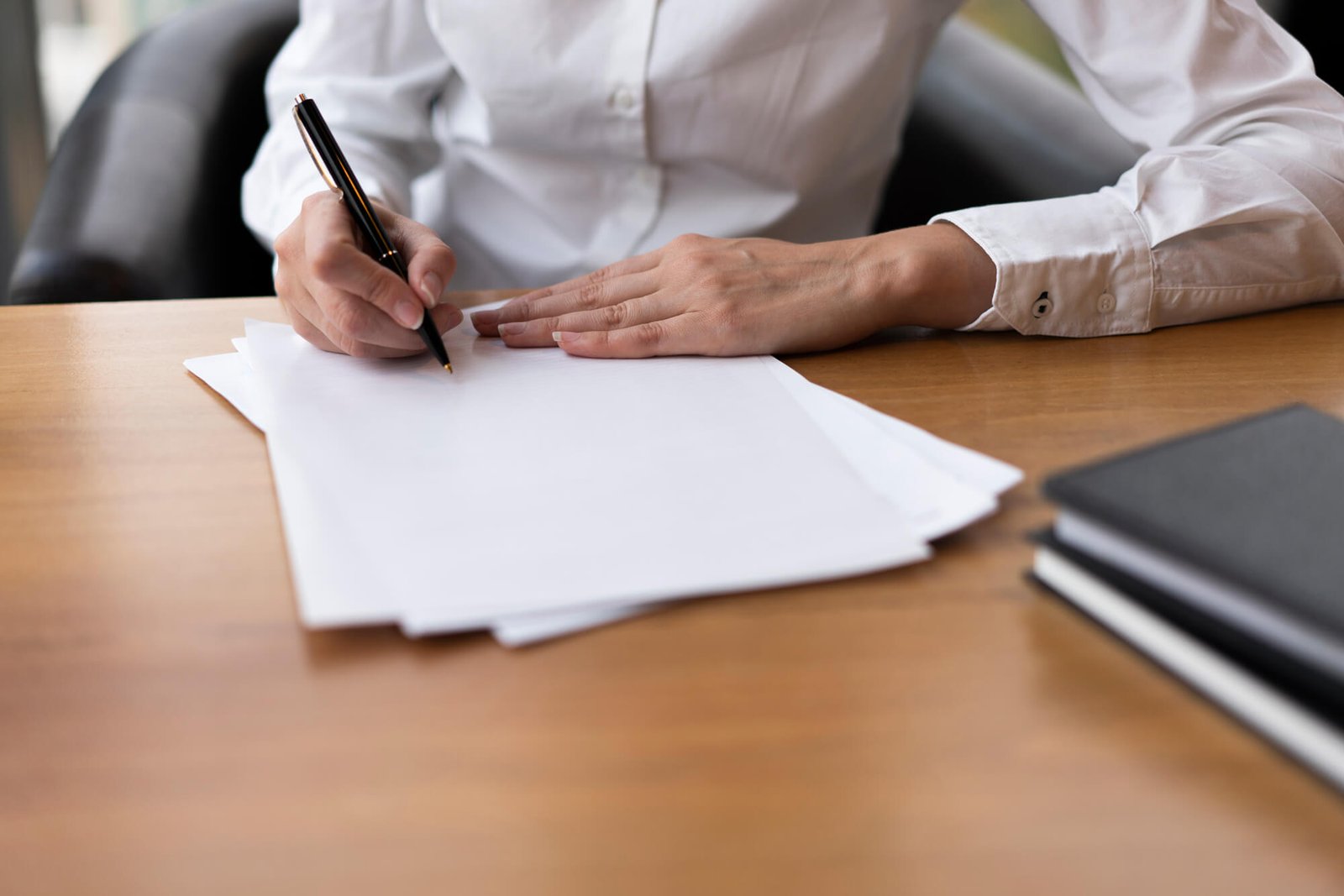 focused-woman-writing-blank-paper_2